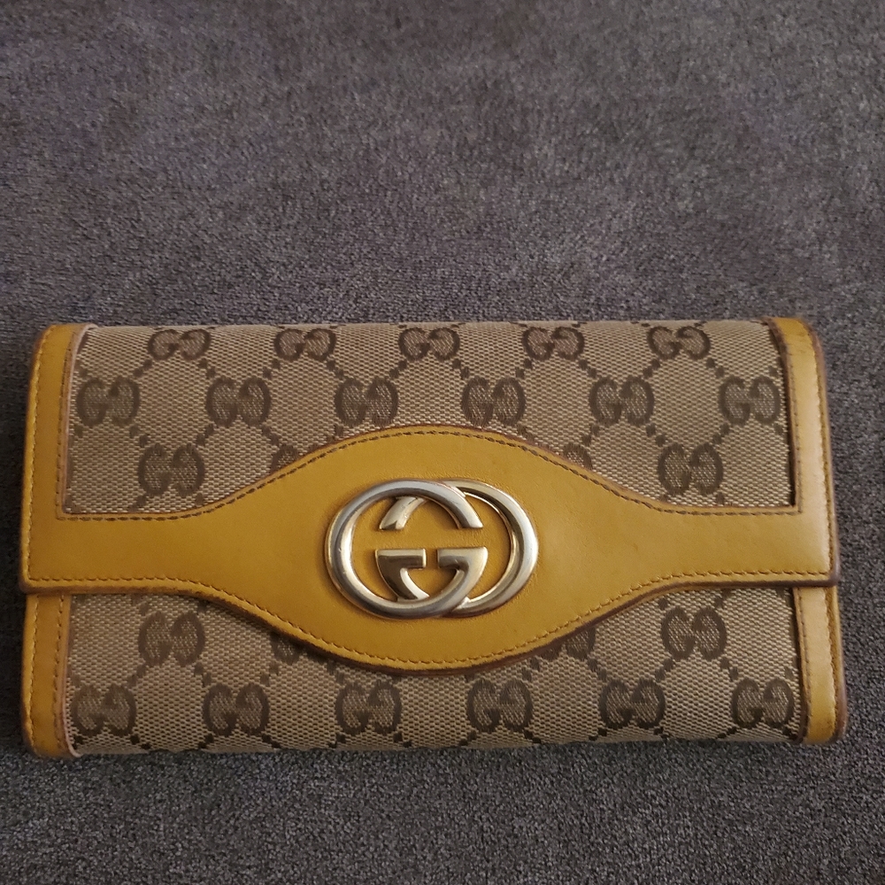 Authentic Gucci signature canvas and leather long wallet.